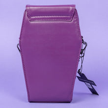 Load image into Gallery viewer, GothX Purple Mini Coffin Bag facing away on a lilac background. The vegan bag has a plain purple faux leather back with two metal D rings either side to attach the detachable strap.