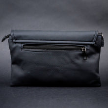 Load image into Gallery viewer, Rear view of CHOK GothX’s alternative black crossbody bag showing a zippered compartment for secure storage against a dark backdrop.
