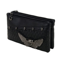 Load image into Gallery viewer, The Gothx winged skull vegan clutch bag on a white studio background. The vegan black leather bag is facing forward angled left to highlight the embossed skull leather, mini skull studs, detachable wrist strap and metal winged skull centrepiece.