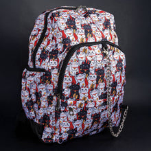 Load image into Gallery viewer, Side view of CHOK GothX's lucky cat backpack with multiple pockets and adjustable straps. The bold and quirky design, coupled with practical storage, makes it a perfect accessory for gothic and alternative aesthetics.