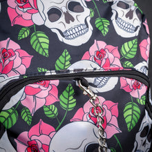 Load image into Gallery viewer, Close-up of chain and front pocket with floral skull pattern – A close-up of the chain accessory attached to the zipper on the front pocket, with a clear view of the white skulls, pink roses, and green leaves pattern on a black background.