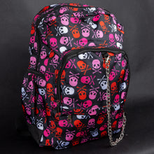 Load image into Gallery viewer, Side view of the CHOK GothX backpack, highlighting bold pink skulls and crossbones in pink, red, and white. Designed for durability and comfort, it features side pockets, padded straps, and edgy chain details. Perfect for alternative fashion enthusiasts.