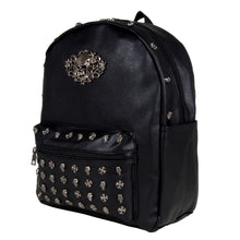 Load image into Gallery viewer, The GothX Skulls and Roses Vegan Backpack shot in front of a white studio background. The bag is angled forward to the left. The black backpack has silver skull and cross studs along the front zip pocket and a rose skull emblem in the middle.