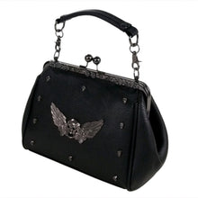 Load image into Gallery viewer, The GothX winged skull vegan vintage clasp handbag on a white studio background. The bag is facing forward angled to the left to highlight the ball clasp close, metal floral detailing along the top, detachable vegan leather handle, mini skull studs and winged skull centre piece.
