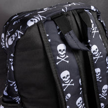 Load image into Gallery viewer, Close-up of a black alternative backpack by CHOK GothX featuring a bold white skull and crossbones pattern. The image highlights the padded shoulder straps and sturdy handle, designed for comfort and durability. Perfect for gothic and edgy styles.
