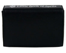 Load image into Gallery viewer, The gothx little book of spells vegan shoulder bag on a white studio background. The bag is resting on the 3d book edge shape facing away from the camera to highlight the white printed spine and plain back.