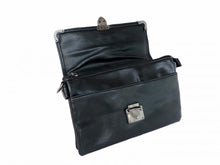 Load image into Gallery viewer, The GothX Crystal skull vegan shoulder bag on a white studio background. The bag is facing forward and opened to highlight the zip up main compartment, front slot pocket, metal clasp clip close and metal corner detailing.