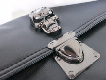 Load image into Gallery viewer, Close up of the crystal metal skull centrepiece and metal clasp clip close on the gothx crystal skull vegan shoulder bag.