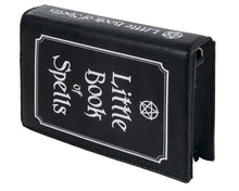 Load image into Gallery viewer, The gothx little book of spells vegan shoulder bag on a white studio background. The bag is resting on the 3d book edge shape to highlight the white printed pentagram and text front and printed spine.
