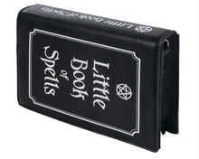 Load image into Gallery viewer, The gothx little book of spells vegan shoulder bag on a white studio background. The bag is resting on the 3d book edge shape to highlight the white printed pentagram and text front and printed spine.