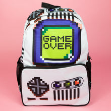 Load image into Gallery viewer, The white game over vegan backpack on a pink studio background. The bag is facing forward to highlight the front game boy inspired print, front zip pocket and side pockets. The backpack features a 90s inspired gameboy print with buttons and a screen saying game over.