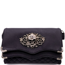 Load image into Gallery viewer, The GothX Skulls and Roses Quilted Clutch Bag shown on a white studio background. The vegan leather clutch bag is facing forward and being opened to highlight the two magnetic clip close flaps with metal corners, a stitch quilted front, a skulls and roses metal centrepiece and two D rings on either side for a detachable strap. The mini bag is inspired by gothic grunge witchy fashion.