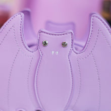 Load image into Gallery viewer, Close up of the front embroidered and crystal eye detailing of the GothX LIMITED EDITION Pastel Lilac Purple Bat Vegan Shoulder Bag in front of a pastel purple background.