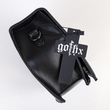 Load image into Gallery viewer, The GothX Ouija Spirit Book Mini Bag laying on its side on a white background to show the metal D ring on either side, the magnetic clip flap closure, zipped middle and plain black vegan leather side.