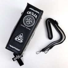 Load image into Gallery viewer, The GothX Ouija Spirit Book Mini Bag sat on a white background. The bag is on its side to highlight the ouija spirit book white printed detailing on the black book bag spine with the 3D planchette stitching. Next to the bag on the right is the adjustable detachable strap. Bag is inspired by witchy style and necromancy.
