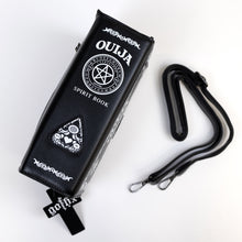 Load image into Gallery viewer, The GothX Ouija Spirit Book Mini Bag sat on a white background. The bag is on its side to highlight the ouija spirit book white printed detailing on the black book bag spine with the 3D planchette stitching. Next to the bag on the right is the adjustable detachable strap. Bag is inspired by witchy style and necromancy.