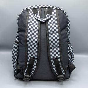The Grey Checkerboard Backpack sat on a grey background. The vegan friendly bag is facing away from the camera to highlight the plain black back, the two side elasticated pockets, the top handle and the two adjustable padded shoulder straps.