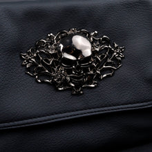 Load image into Gallery viewer, Close-up shot of the metallic skull centrepiece on CHOK GothX’s vegan leather gothic bag, emphasising its detailed rose and vine embellishments.
