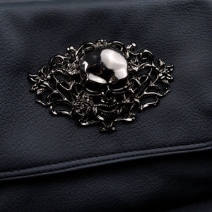 Close-up shot of the metallic skull centrepiece on CHOK GothX’s vegan leather gothic bag, emphasising its detailed rose and vine embellishments.