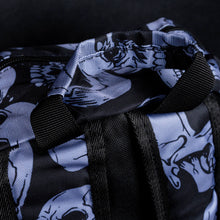 Load image into Gallery viewer, Close-up of handle and top of backpack with grey skull pattern – The top view of the backpack, highlighting the sturdy handle and grey skull pattern, adding a bold alternative touch.
