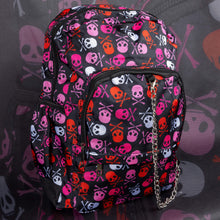 Load image into Gallery viewer, Side detail shot of the CHOK GothX pink skull and crossbones backpack’s chain and bold graphics. Made with high-quality nylon, this gothic bag combines edgy aesthetics with practical features like laptop storage, adjustable straps, and zip pockets.
