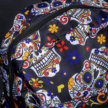 Load image into Gallery viewer, Close-up of sugar skull pattern on top of backpack – Detailed view of the sugar skull pattern on the top of the backpack, showcasing intricate floral designs in vivid colours, perfect for those with a love for bold, artistic styles.
