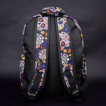 Load image into Gallery viewer, Back view of sugar skull backpack with padded straps – The back of the backpack displays the sugar skull pattern on the padded shoulder straps, providing both style and comfort for the wearer.
