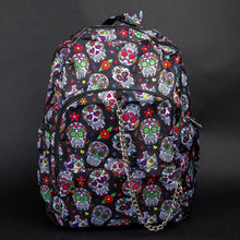 Load image into Gallery viewer, Front view of the CHOK GothX Sugar Skull Backpack, showcasing a bold sugar skull print on black nylon, silver chain detailing on the front pocket, and multiple zips for style and functionality. Perfect for gothic and alternative fashion lovers.
