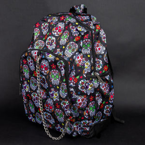 Side view of the CHOK GothX Sugar Skull Backpack, featuring its two side pockets, adjustable shoulder straps, and vibrant sugar skull print. Designed for both comfort and edgy style.