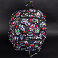 Load image into Gallery viewer, Top view of the CHOK GothX Sugar Skull Backpack, showcasing its secure double-zip opening, bold sugar skull design, and easy-to-carry handle. A perfect mix of style and practicality.
