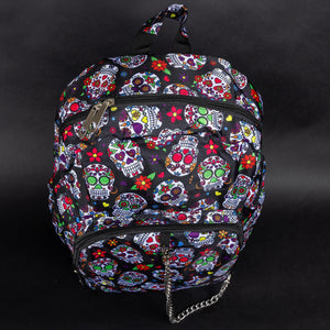 Top view of the CHOK GothX Sugar Skull Backpack, showcasing its secure double-zip opening, bold sugar skull design, and easy-to-carry handle. A perfect mix of style and practicality.