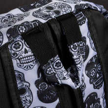 Load image into Gallery viewer, Back detail of a CHOK GothX sugar skull backpack in white with black skull patterns. Durable straps and quality materials make this gothic bag an essential for alternative fashion fans who need both comfort and style.
