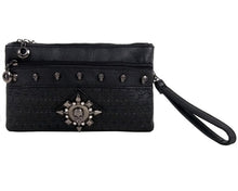 Load image into Gallery viewer, The gothx black skull vegan clutch bag on a white studio background. The clutch is facing forward to highlight the skull embossed vegan black leather, the crystal stud skull centrepiece, zip pocket, wrist strap and skull studs.
