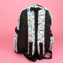Load image into Gallery viewer, The kawaii unicorn vegan backpack sat on a pink background. The bag is facing away to highlight the pastel blue rainbow unicorn print on the padded adjustable shoulder straps, two side pockets, top handle and plain black back.
