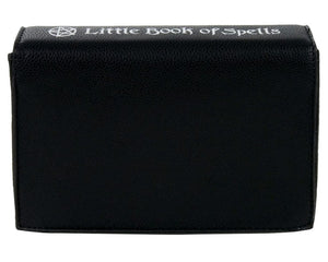 The gothx little book of spells vegan shoulder bag on a white studio background. The bag is resting on the 3d book edge shape facing away from the camera to highlight the white printed spine and plain back.