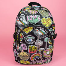 Load image into Gallery viewer, The kawaii graffiti doodle vegan backpack sat on a pink studio background. The bag is facing forward to highlight the two front zip pockets, two elastic side pockets and silver chain. The all over print has lollipops, pugs, rainbows, pizzas, polaroid cameras, eyes and fries.
