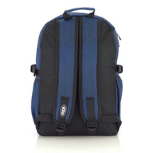 Load image into Gallery viewer, The CHOK Blue Commuter Vegan Backpack on a white studio background. The dark grey blue canvas bag is facing away from the camera to highlight the elastic side pockets, adjustable shoulder straps, top handle and chok logo on the left strap.
