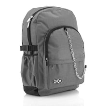 Load image into Gallery viewer, The CHOK Grey Commuter Vegan Backpack on a white studio background. The light grey canvas bag is facing forward angled right to highlight the two front zip pockets, elastic side pockets, detachable silver chain and chok logo.
