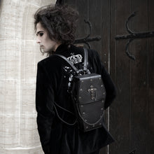 Load image into Gallery viewer, Sweeney wearing a goth outfit and the gothx coffin vegan backpack on their back. They are facing away from the camera to highlight the cross mini studs, cross and chain emblem and detachable silver chain.
