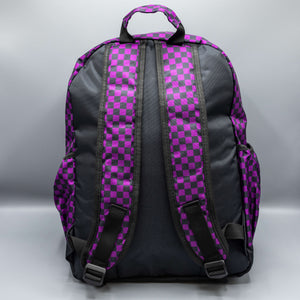 The Purple Checkerboard Backpack sat on a grey background. The vegan friendly bag is facing away from the camera to highlight the plain black back, the two side elasticated pockets, the top handle and the two adjustable padded shoulder straps.