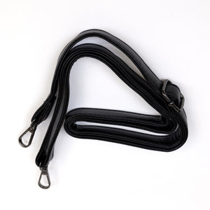 The vegan black leather adjustable detachable strap on a white background from the GothX Ouija Spirit Book Mini Bag.