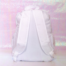 Load image into Gallery viewer, The white nylon vegan backpack with chain on an iridescent background. The bag is facing away from the camera to highlight the padded adjustable shoulder straps, top handle and two side pockets.
